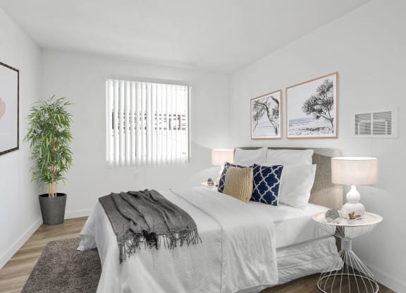 Bedroom with white walls and white bedding at Harvard Manor, Irvine, 92612