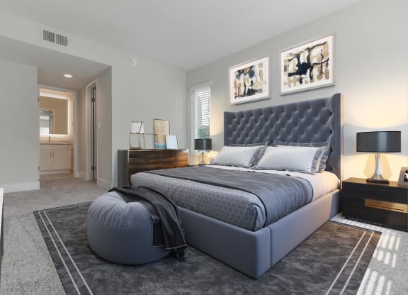 a bedroom with a bed and a dresser in a room  at Laguna Gardens Apts., California