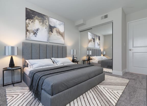 a bedroom with a bed and a mirror  at Laguna Gardens Apts., Laguna Niguel