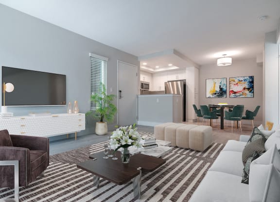a living room with blue walls and a large tv on the wall  at Laguna Gardens Apts., California