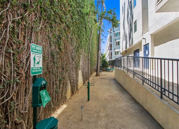 a walkway next to an apartment building  at Masselin Park West, California