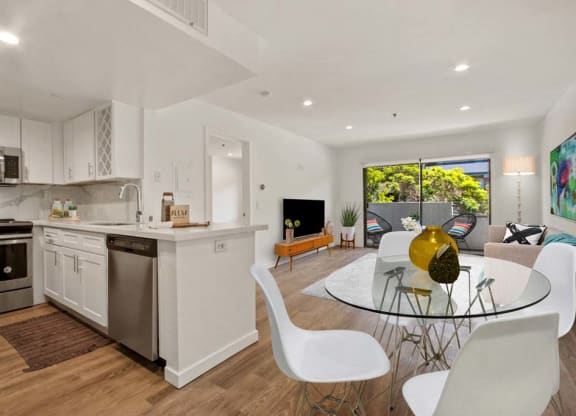 a kitchen and dining room with a table and chairs  at Masselin Park West, Los Angeles, California