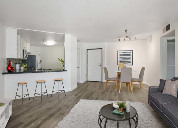 a living room with a couch and a table  at Masselin Park West, Los Angeles, California