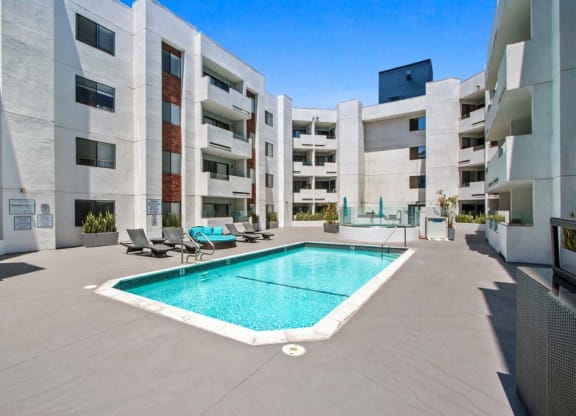 a pool is shown in front of an apartment building  at Masselin Park West, California, 90036