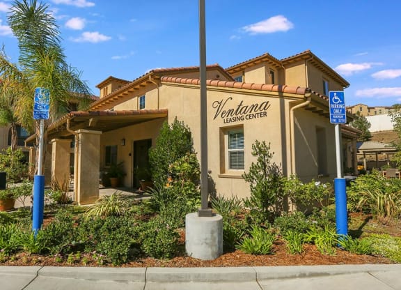 a building with a sign on the side of it at  Ventana Senior Apartments, Porter Ranch ,91326