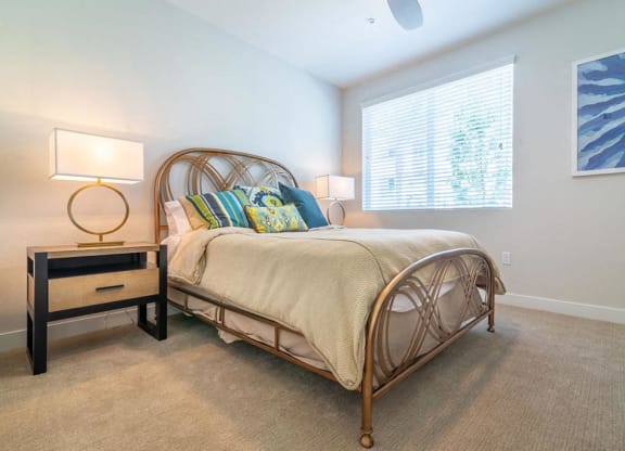 Bedroom with bed at Montecito Apartments at Carlsbad, California