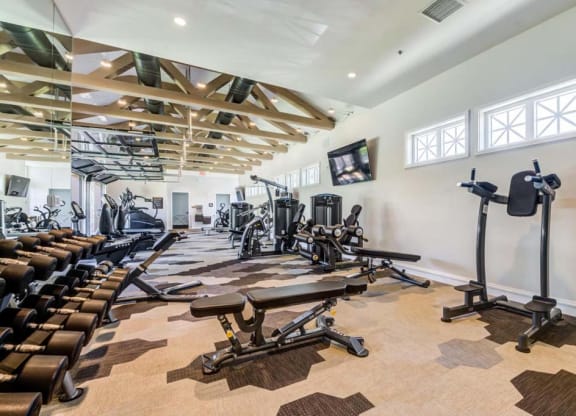 a spacious gym with treadmills and other exercise equipment at The Vineyards Apartments, Porter Ranch, 91326