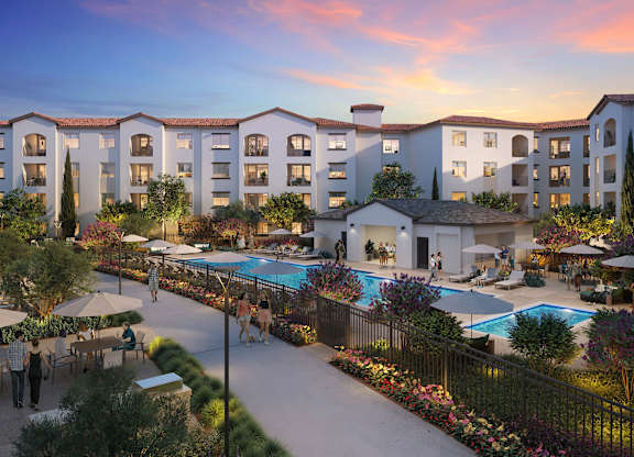 A resort with a pool and a building in the background at Pradera Apartments, San Ramon, CA,  94582
