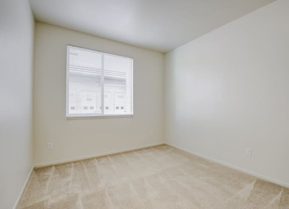 a bedroom with white walls and a window  at Seville at Gale Ranch, San Ramon, CA