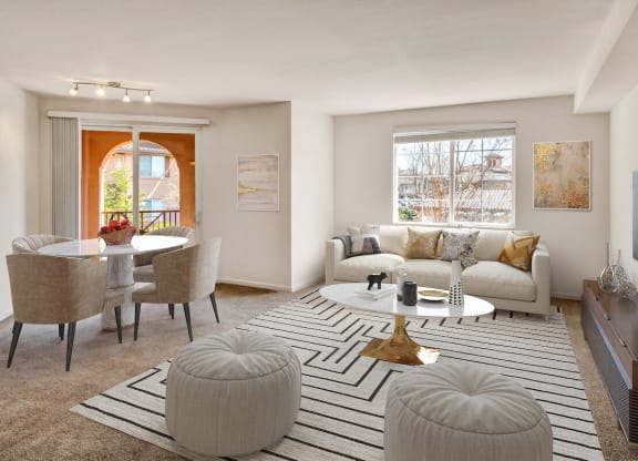 a living room with a white couch and a white coffee table with two ottomans  at Falcon Bridge at Gale Ranch, San Ramon, 94582
