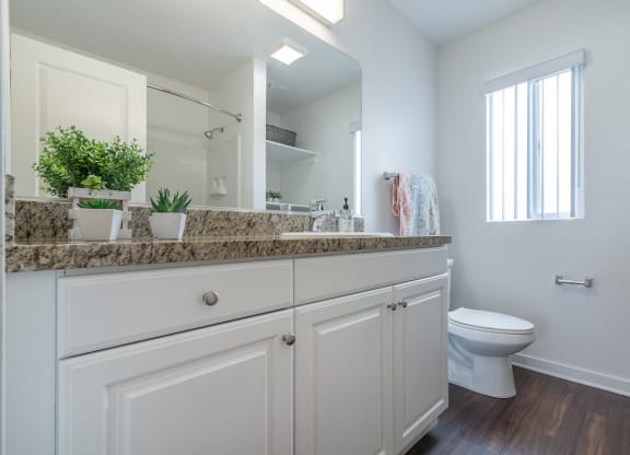 Renovated Bathrooms With Quartz Counters at Park Apartments, California, 90650