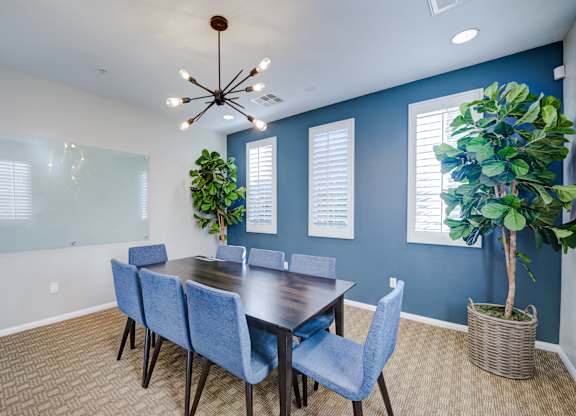 A conference room with a long table and chairs at Sonoma at Porter Ranch, CA, 91326