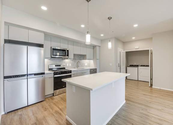 Kitchen with stainless steel appliances with full washer dryer at The Overlook Santa Clarita, CA 91350