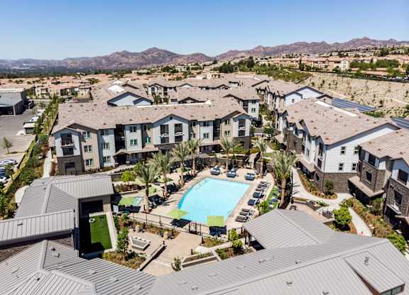 an aerial view of a resort style community at The Vineyards Apartments, Porter Ranch, CA