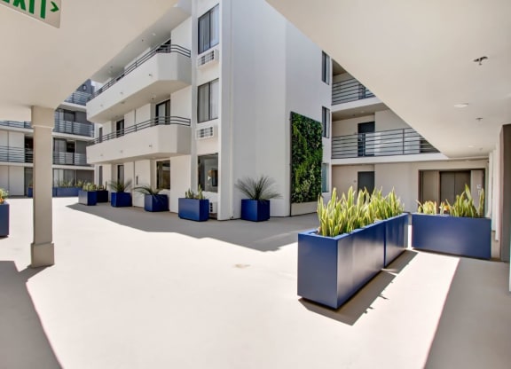 a large white building with a large blue planter in front of it at The Kenmore Los Feliz, Los Angeles, 90027-4063