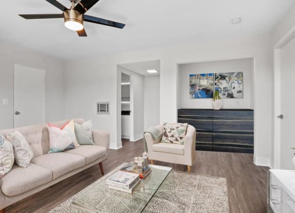 a living room with a couch and a chair at Palm Capri Apartments, Burbank