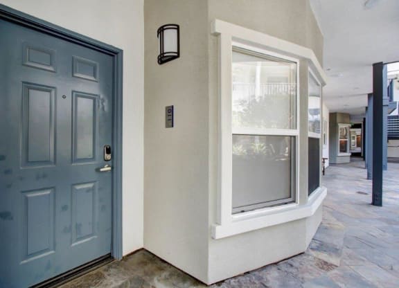 a blue door with a window next to it at Toluca Court, Toluca Lake