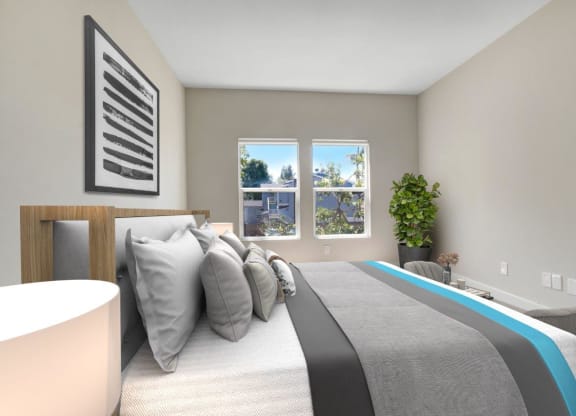 a bedroom with a bed and two windows at Toluca Court, Toluca Lake