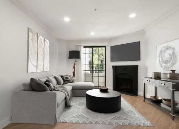 a living room with a couch and a table at Burton, Los Angeles, CA