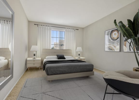 a bedroom with a bed and a mirror and a window at Darlington Apartments, Los Angeles