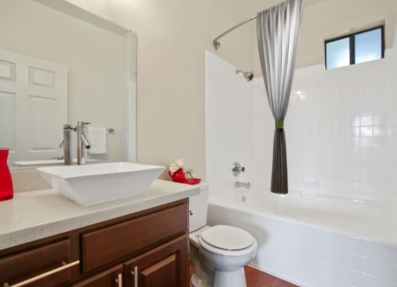 a bathroom with a sink and a toilet and a shower at Darlington Apartments, Los Angeles, CA