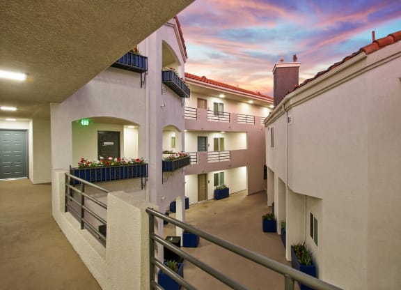 a balcony with a view of a colorful sky at Alon Apartments, Los Angeles, CA