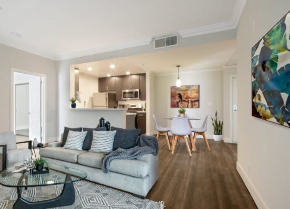 a living room with a couch and a table with chairs at Atrium, Los Angeles, CA, 90024