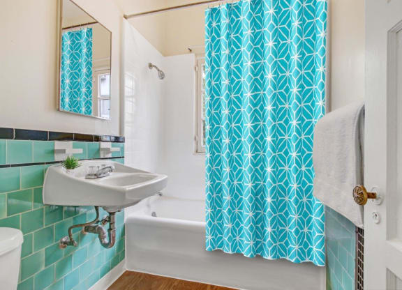 a bathroom with a sink and a bathtub  at 1022 Tiverton, Los Angeles, 90024