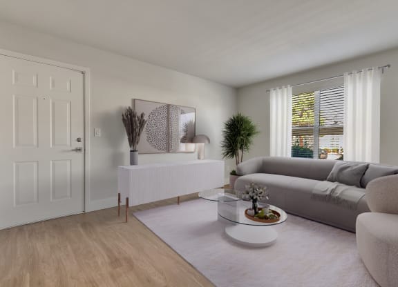 a living room with a grey couch and a white coffee table at Bella Terra Apartments, Henderson, Nevada