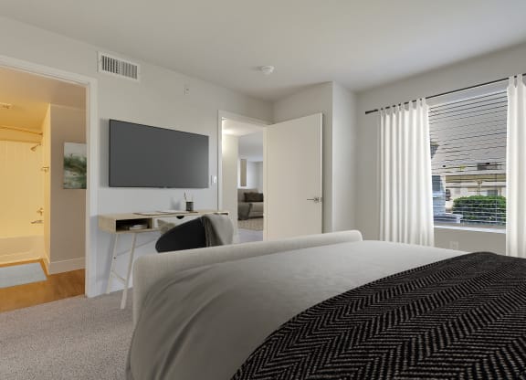 a bedroom with a bed and a desk and a tv at Bella Terra Apartments, Henderson, NV