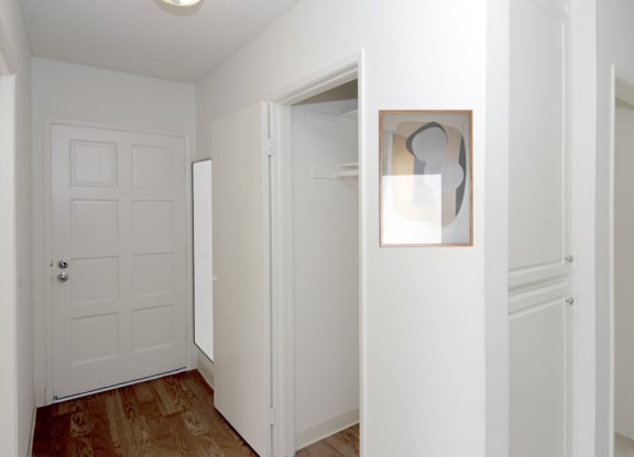 a bedroom with a white door and a painting on the wall at The Villas at Monarch Beach, Dana Point, California