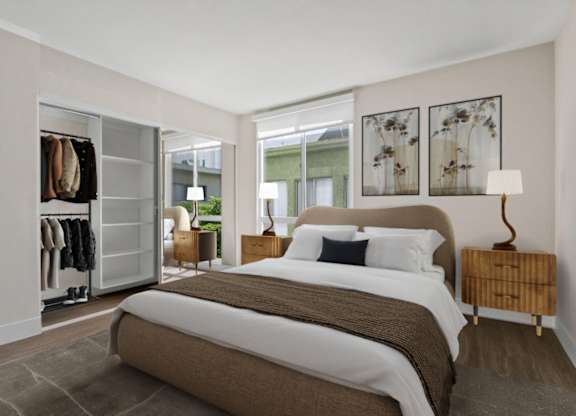 A bedroom with a large bed and a wardrobe at Rochester Apartments, California