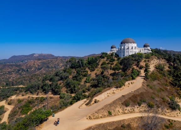 a view of the griffith observatory from the top of a hill at The Kenmore Los Feliz, Los Angeles, CA