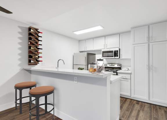A kitchen with white cabinets and a white counter top at Waverly, Los Angeles, CA