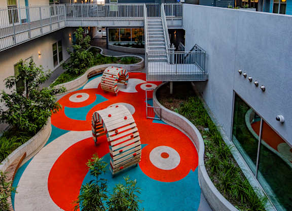 A playground area with a slide and a ball pit.