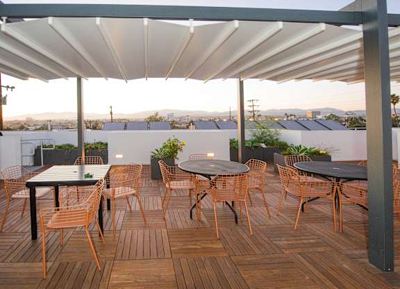 Rooftop common area with tables and chairs