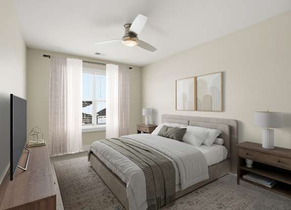 A bedroom with a large bed, a flat screen TV, and a ceiling fan.