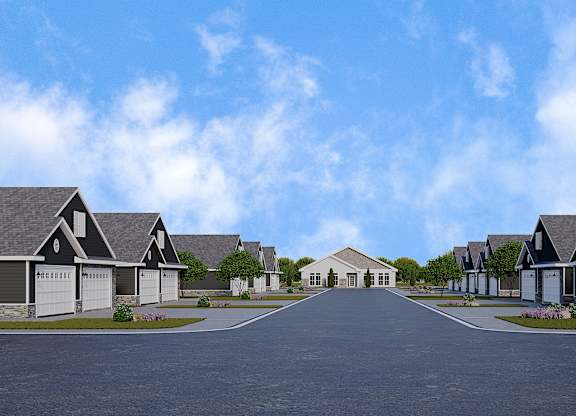 A row of houses with driveways in front.