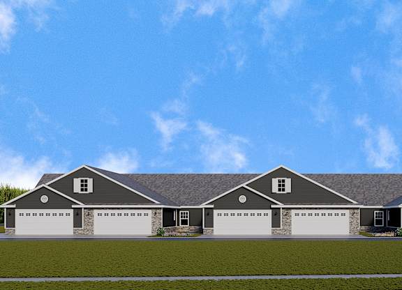 A large house with a grey roof and four garages.
