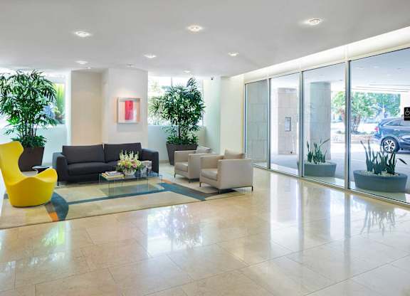 Lobby area with seating at Wilshire Margot, Los Angeles, CA