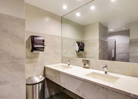Renovated Bathroom with quartz countertops, recessed lightings