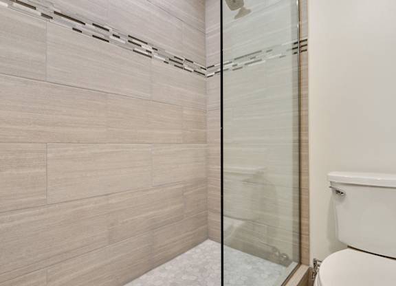 Bathroom with shower stand, glass door