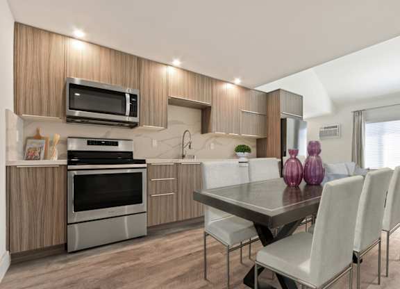 Kitchen with stainless steel appliances, wood kitchen cabinets, recessed lighting, wood style floors