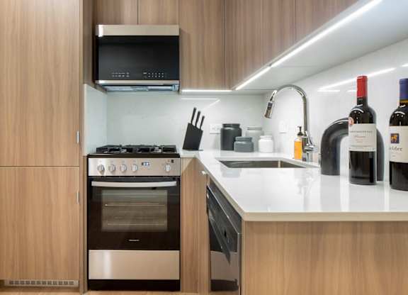 a kitchen with a stove and a sink at The Aster, Los Angeles, California
