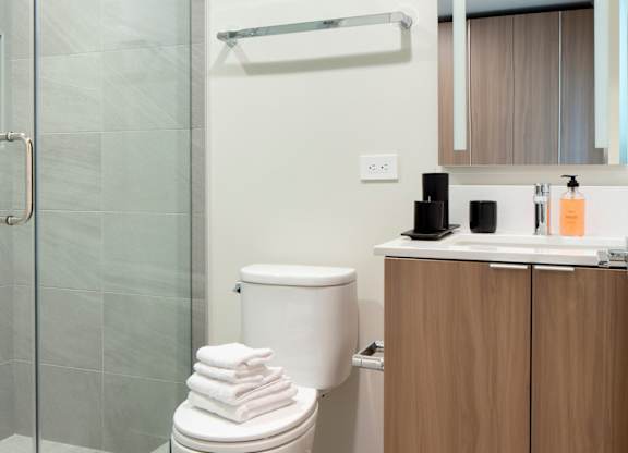 a bathroom with a toilet and a sink and a shower at The Aster, Los Angeles, 90024