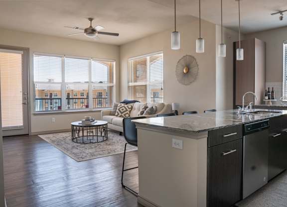 an open floor plan with a kitchen and living room