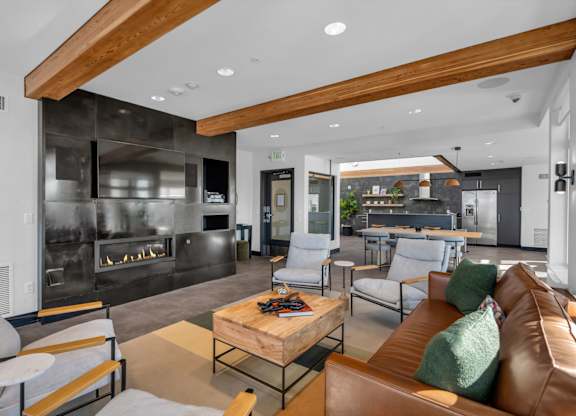 Contemporary lounge area with fireplace and wood ceiling at The Lyric Apartments, Washington, 98102