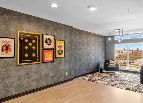 Contemporary gallery wall with vintage pop art at The Lyric Apartments, Washington