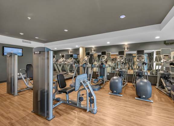 Fitness center with cardio equipment at The Lyric Apartments, Seattle, Washington