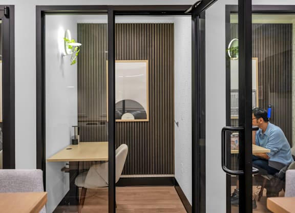 Private workspace pods with acoustic panels at The Lyric Apartments, Seattle, Washington